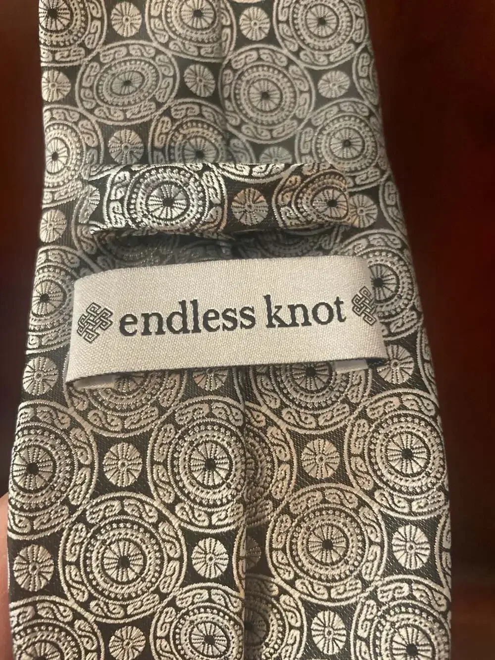 Endless Knot Silver and Black Geometric Medallion Silk Tie